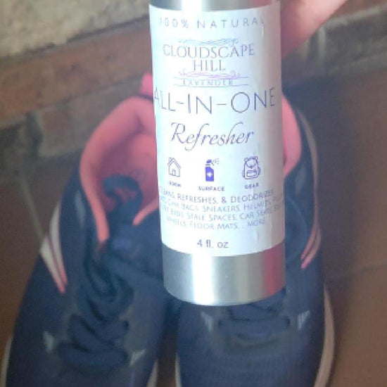 Lavender refresher spray misting onto surfaces — natural deodorizer and fabric freshener