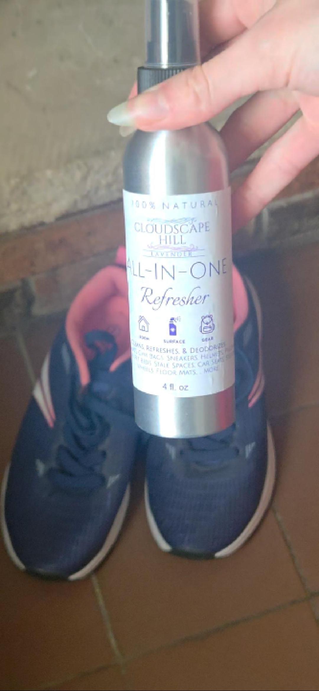 Lavender refresher spray misting onto surfaces — natural deodorizer and fabric freshener